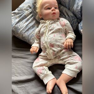 Reborn baby doll with belly plate
